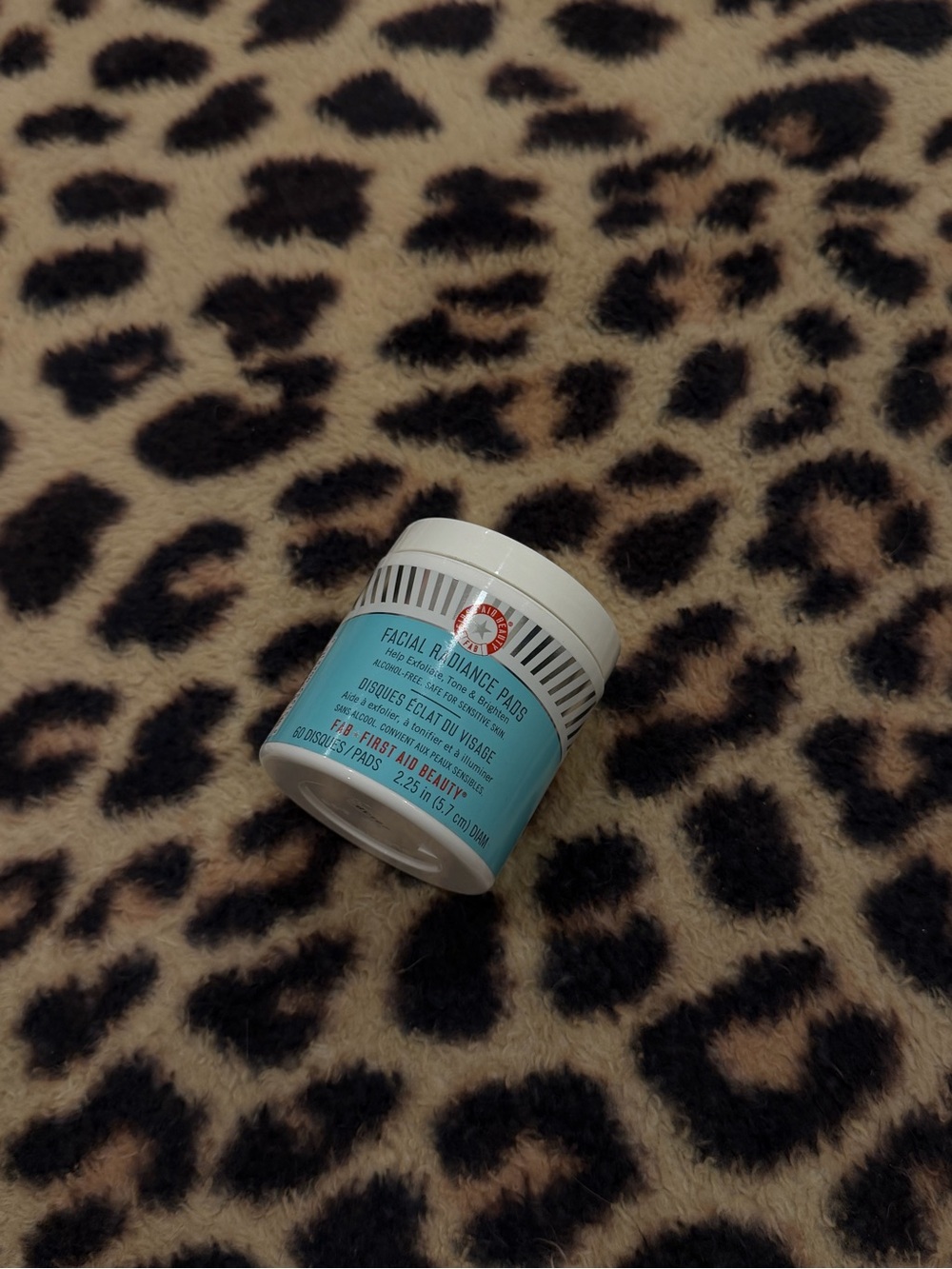 First Aid Beauty Facial Radiance Pads in light blue and white jar